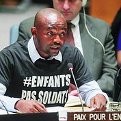 alt="Junior Nzita Nsuami, Président et Fondateur de Paix pour l’Enfance1"